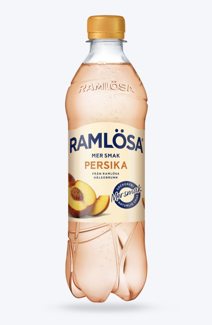 En flaska Ramlösa med smaken mer smak persika